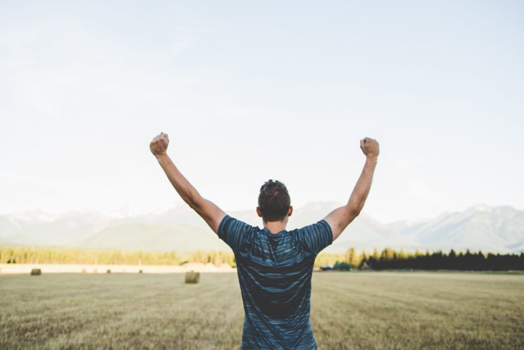 Think Cirrus/Customer Service Excellence/Winning man with arms in the air