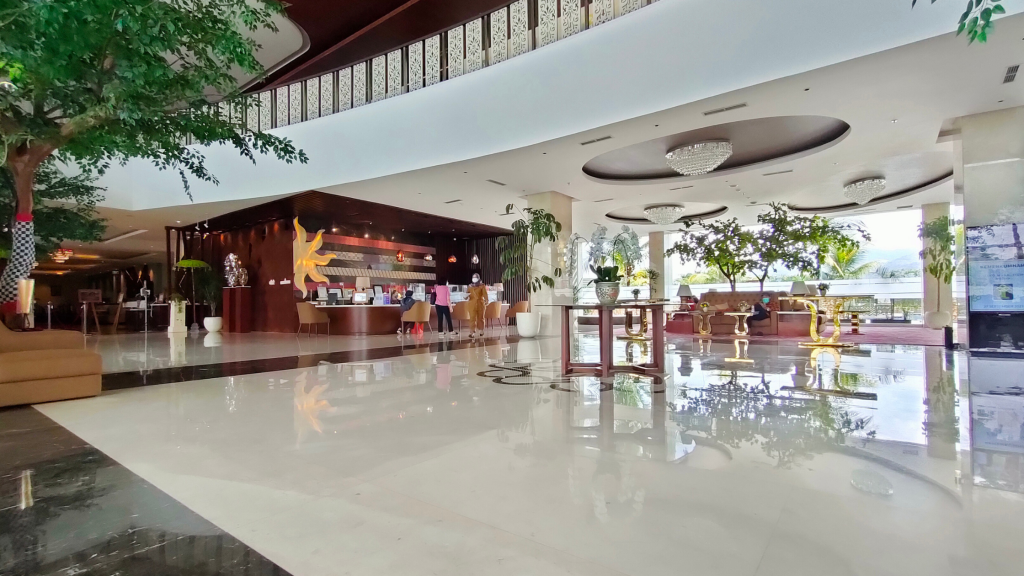 Modern hospitality venue reception area with clean technology integration and professional setup